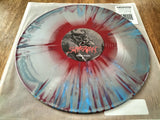 Vinyl record with a colorful design on a wooden surface