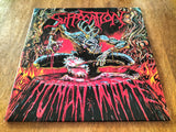 Vinyl record cover with a graphic design featuring a skeleton and flames on a wooden surface